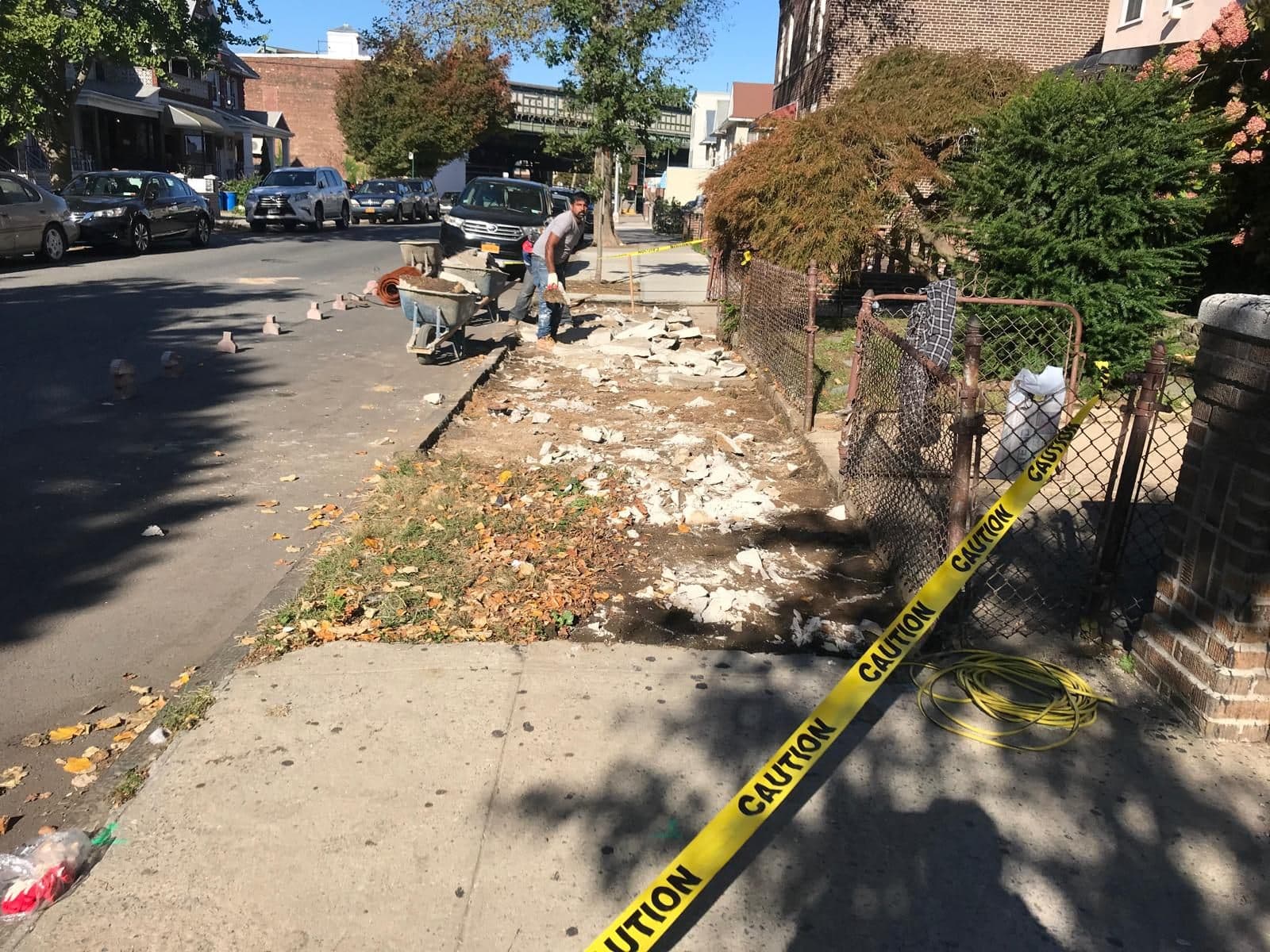Old sidewalk taped off before work began