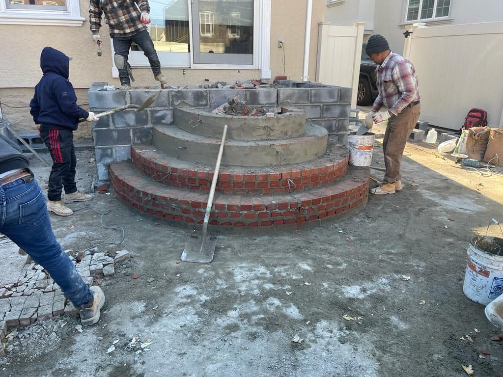 Crew building the curved porch steps
