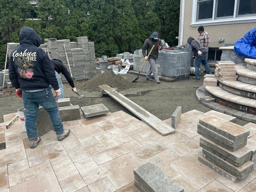 New pavers being laid across the backyard