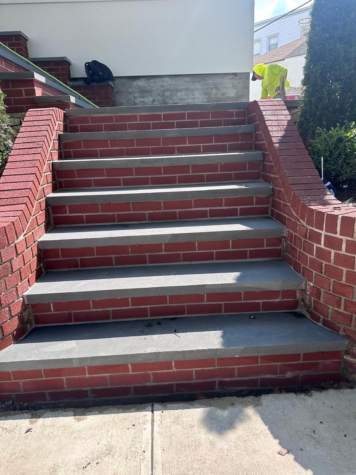 Finished stone steps between brick walls