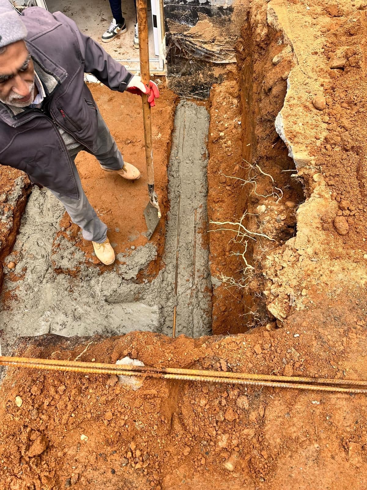 Concrete footing poured in the trench