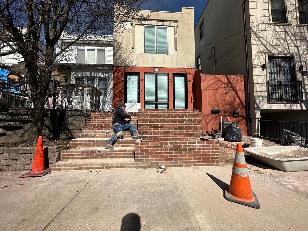 Before: house front with rough steps and a partly finished facade