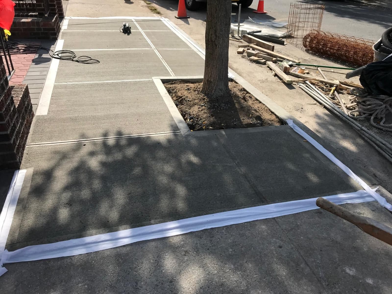 New sidewalk formed and poured at the street