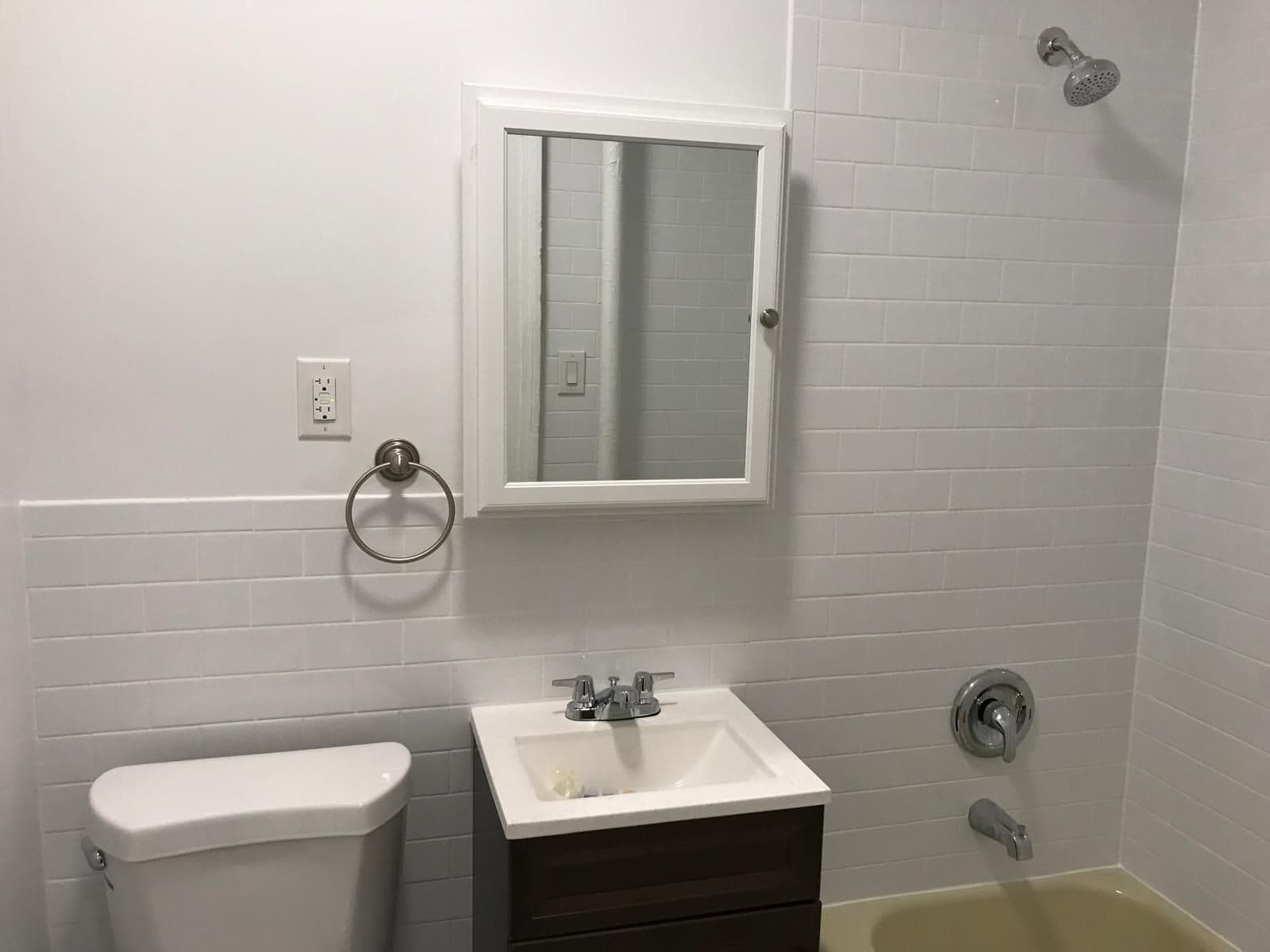 Finished bathroom with new vanity and tile