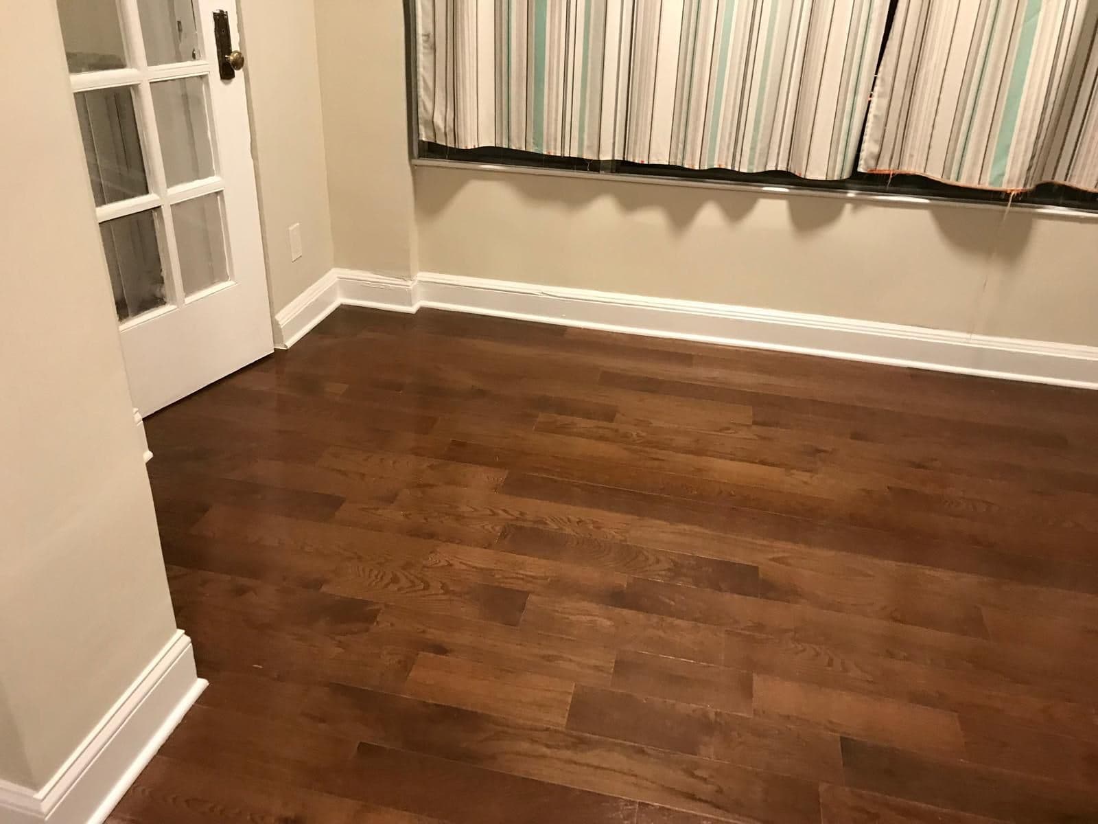 Finished room with new wood floor and fresh paint