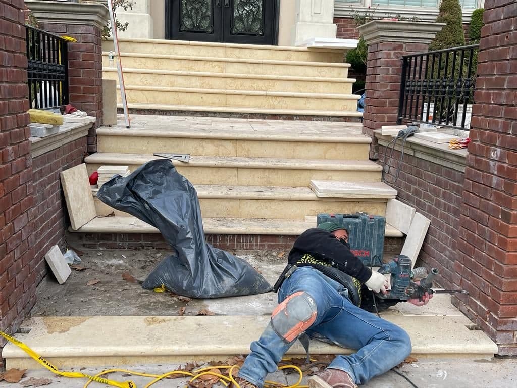 Crew setting Jerusalem stone on the steps