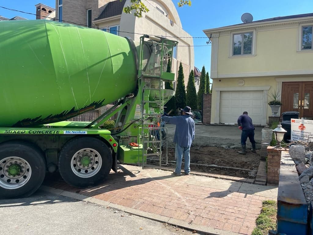 Concrete truck pouring the base at the front of the house
