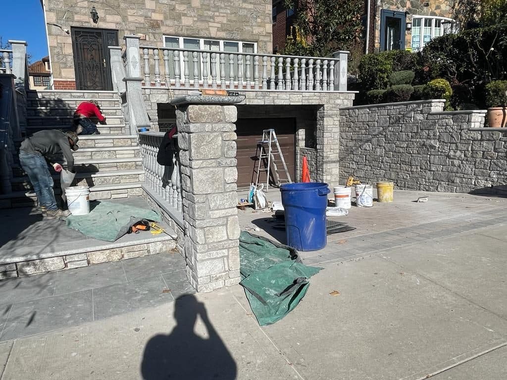 Crew cladding the walls and columns in stone