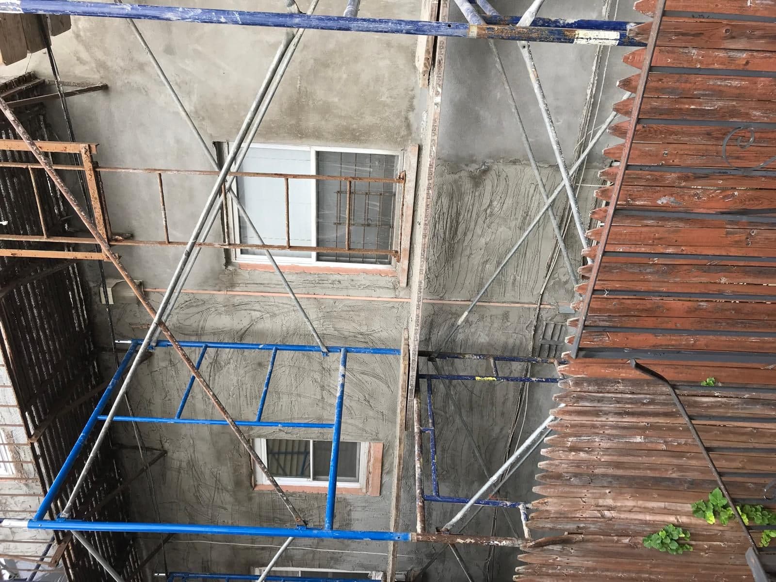 Grey cement base coat on the wall