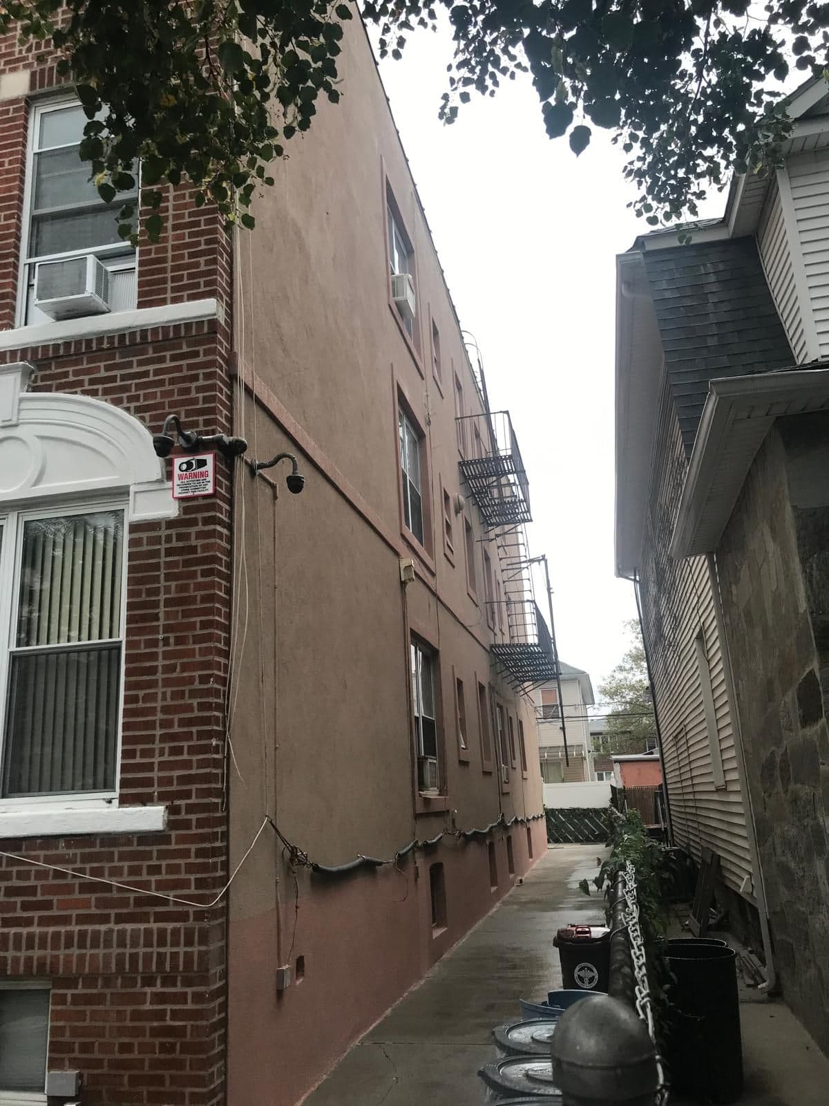 Side of the building finished in cement stucco