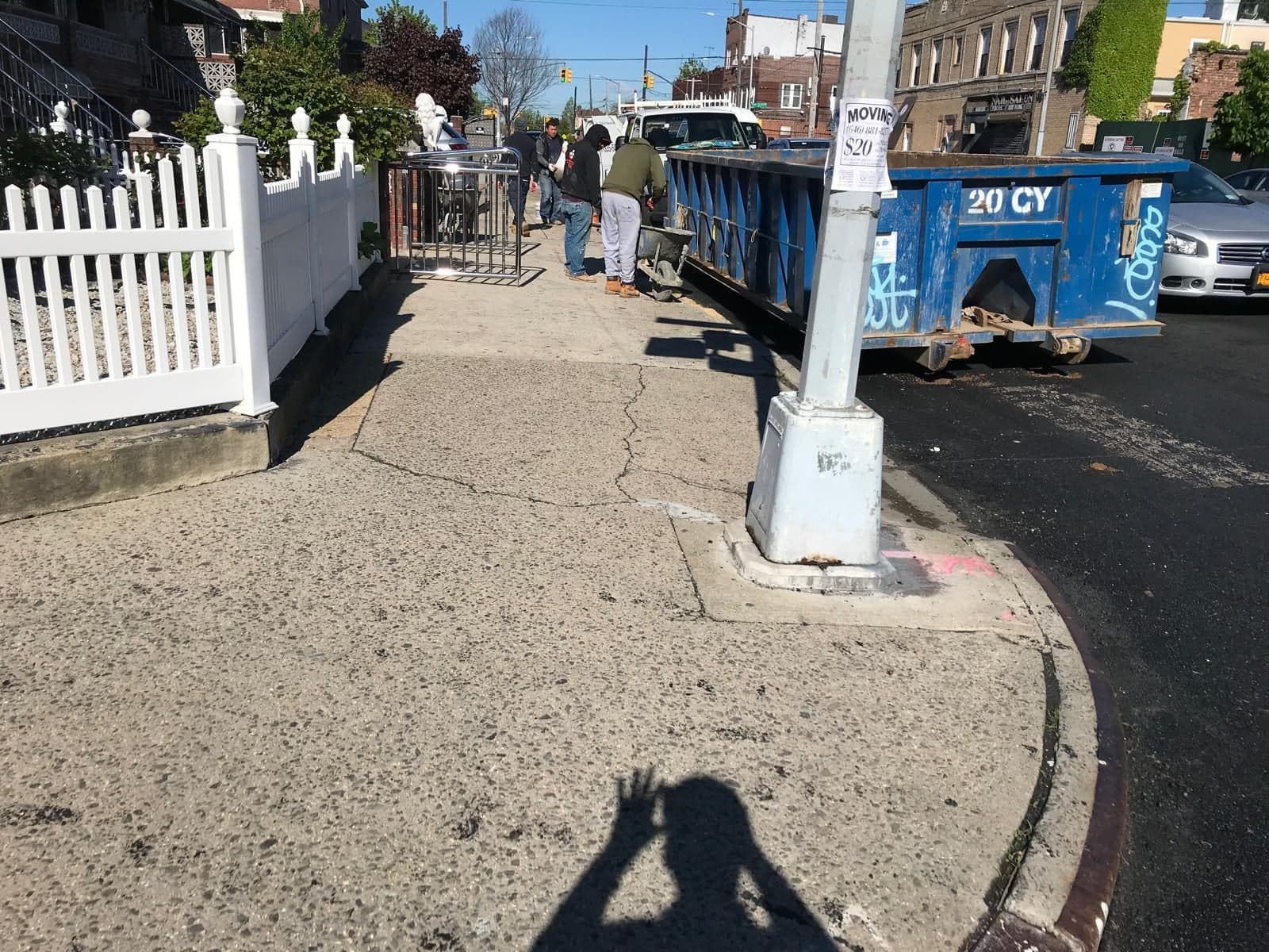 Old cracked sidewalk at the corner before work