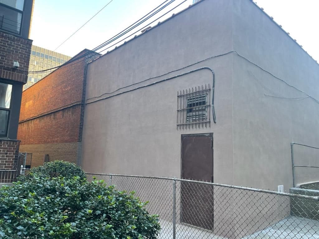 Finished stucco on the end wall and door