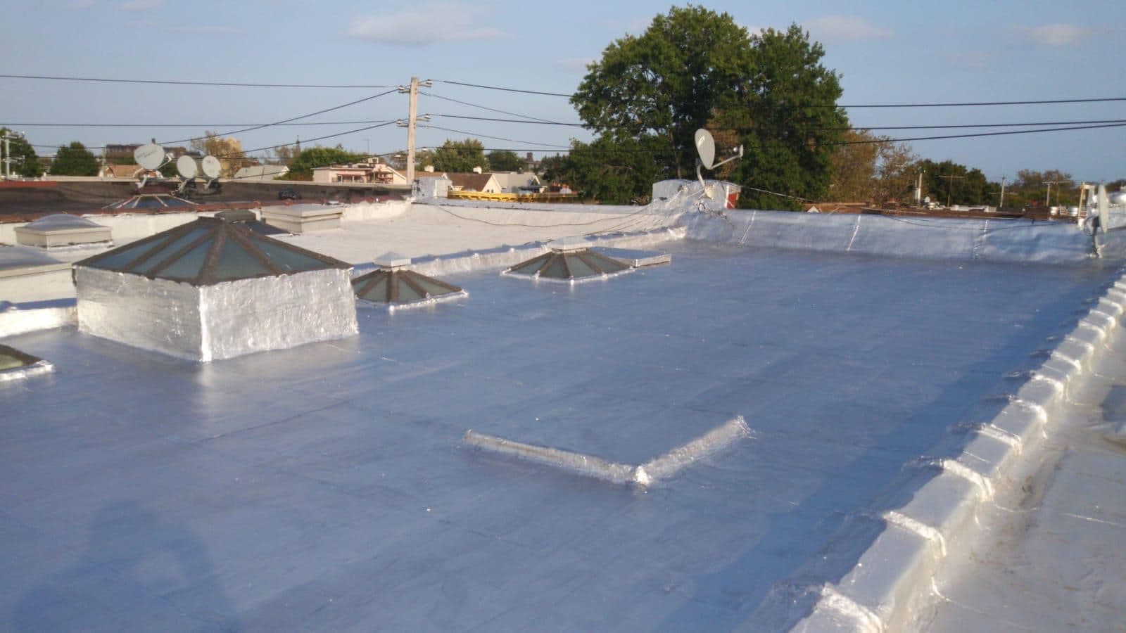 Flat roof after repair and silver coating