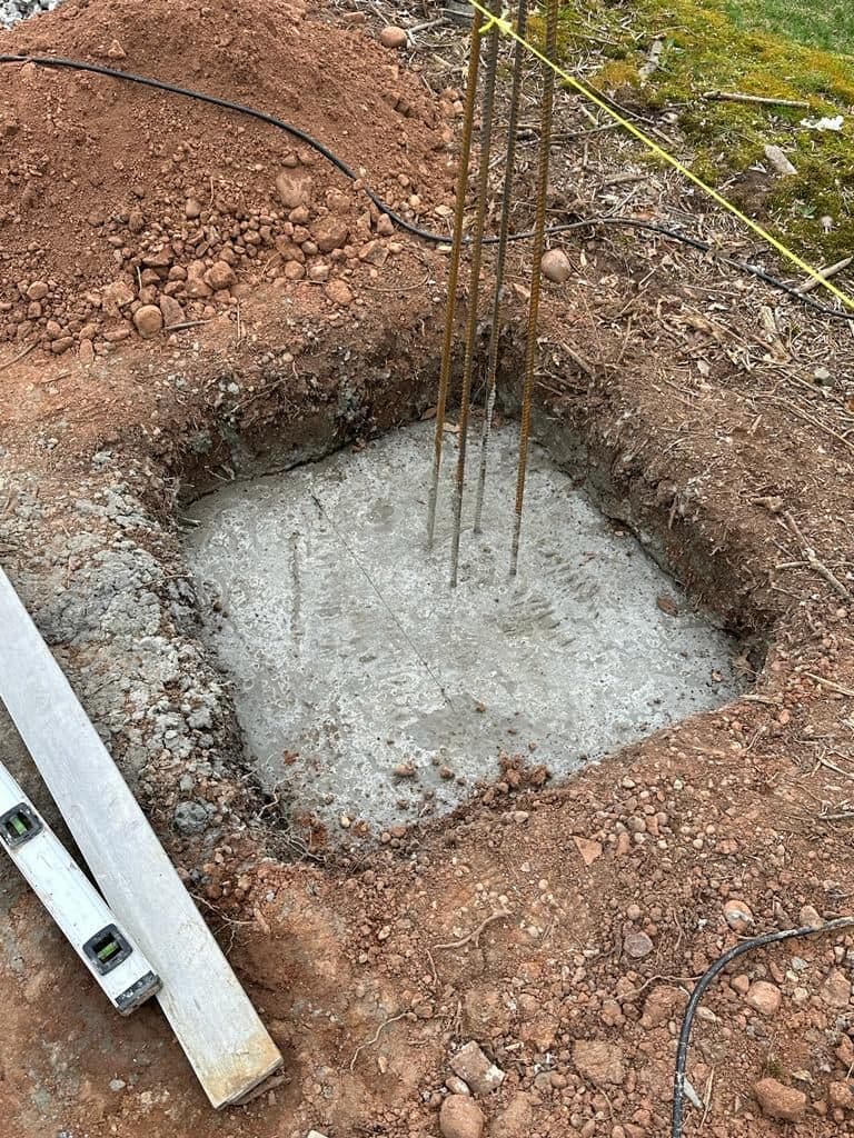 Concrete footing with steel rebar for a new column