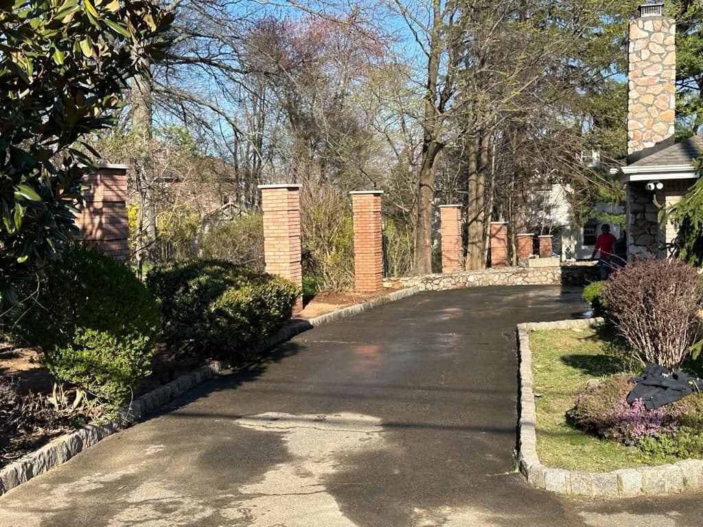 Row of new brick columns lining the driveway