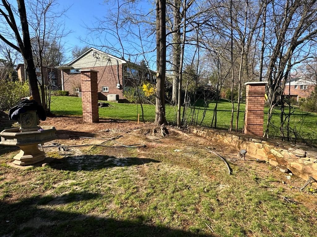 After: new red-brick columns along the yard
