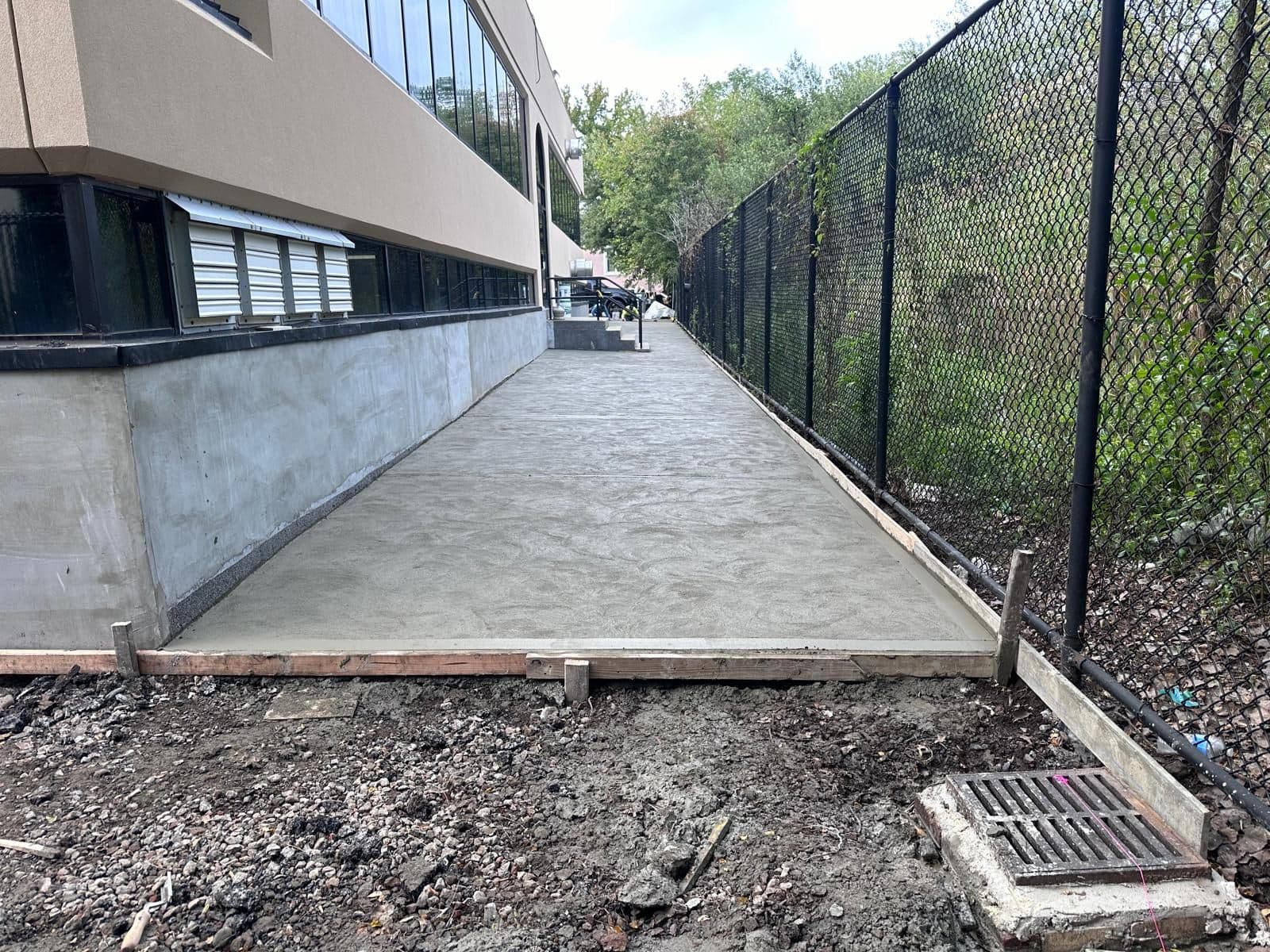 After: new concrete walkway along the same building