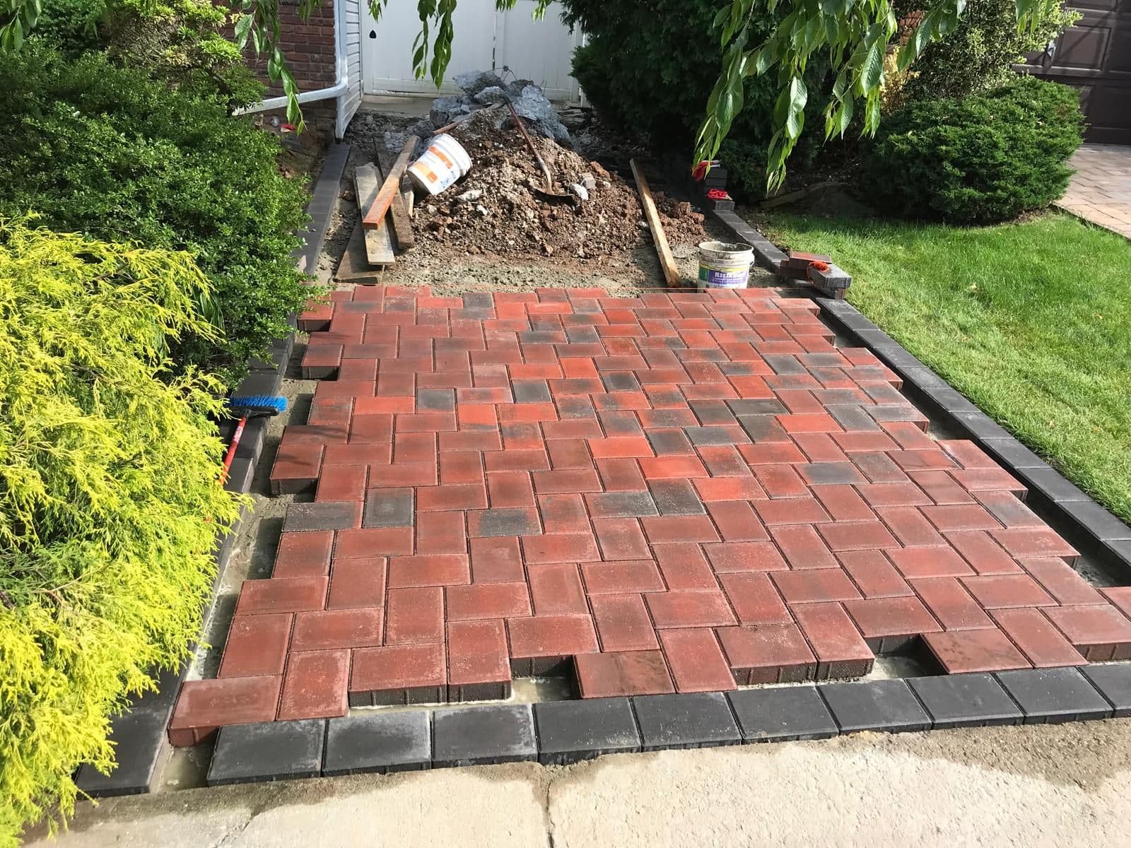 Driveway pavers with the dark border going in