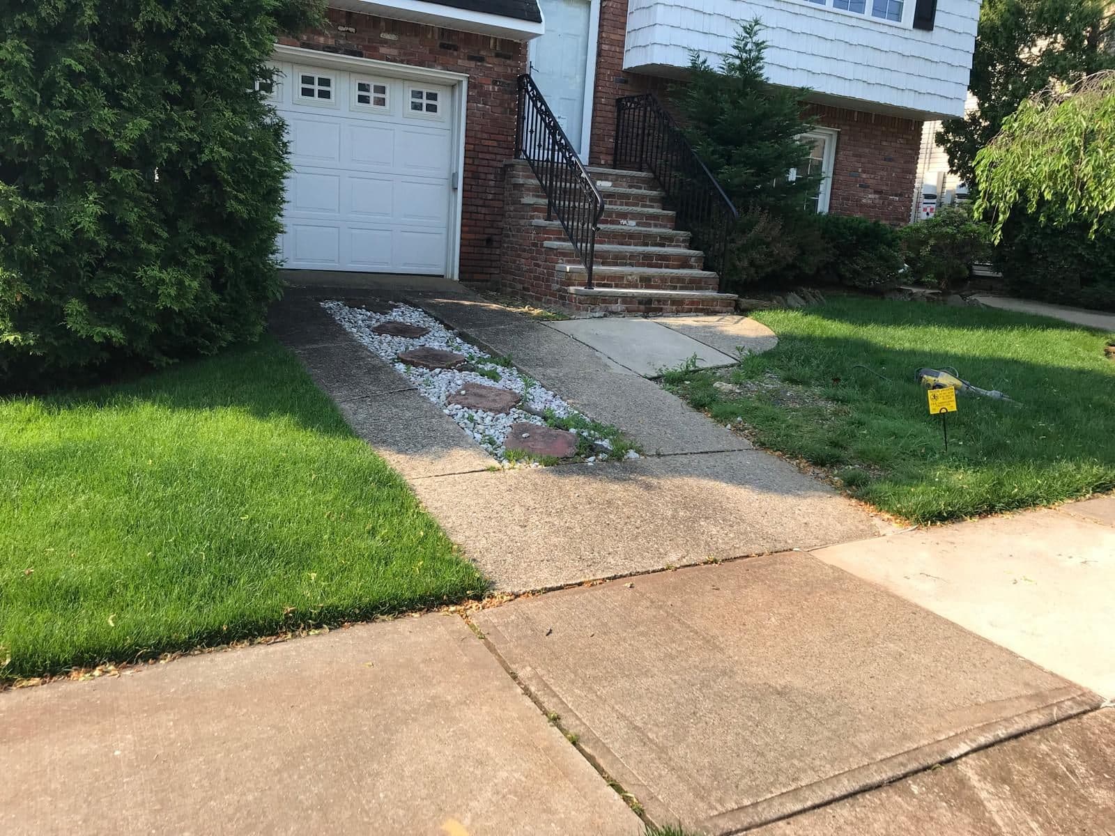 Before: old concrete driveway in front of the garage