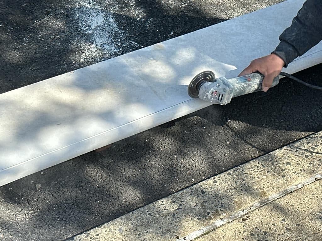 Mason cutting a Jerusalem stone tread to size
