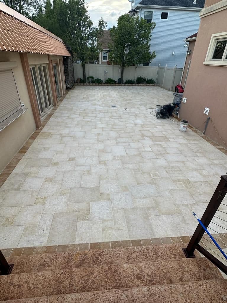 After: the same backyard finished in Jerusalem stone