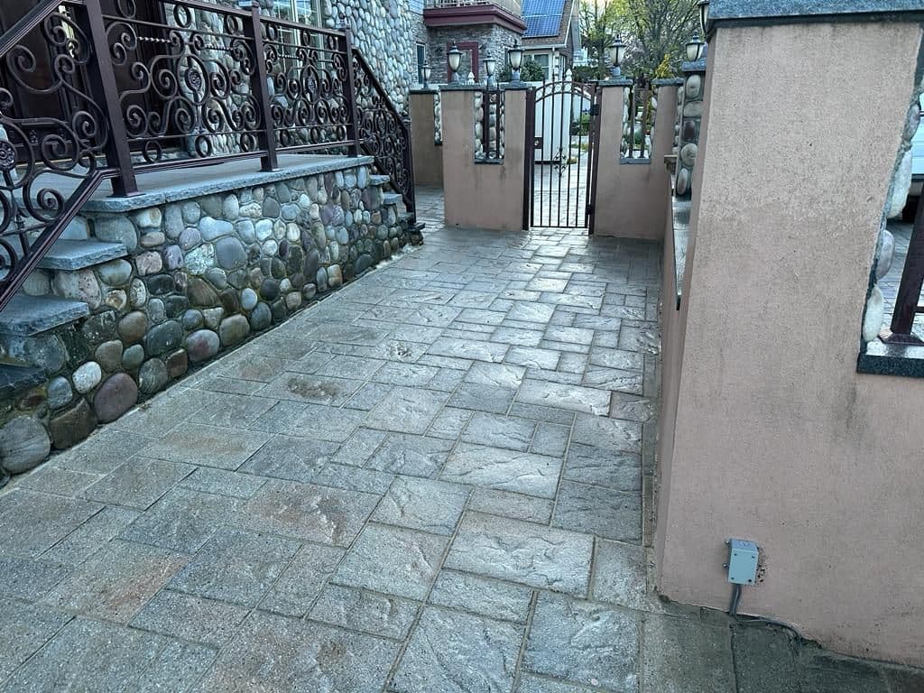 Cleaned stone path along the side of the house