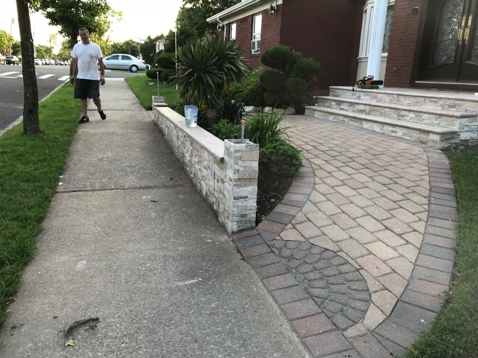 Finished stone garden wall along the walkway