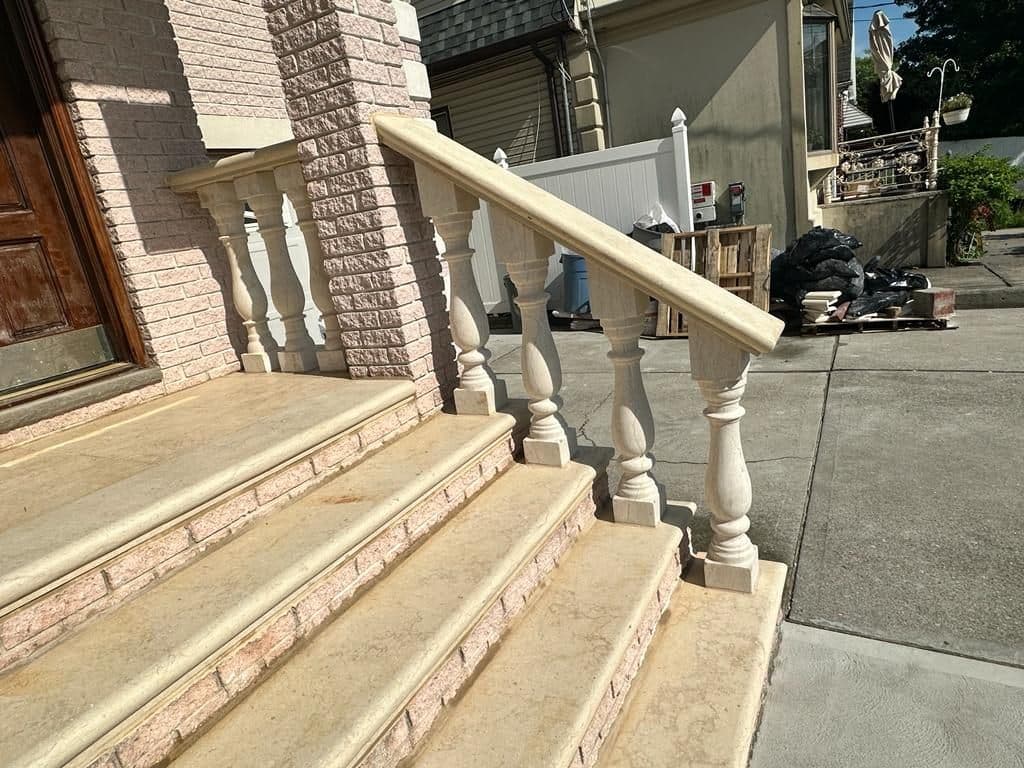 Stone balusters and railing along the new steps