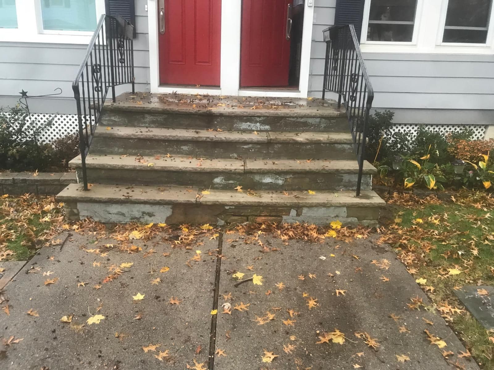 Before: old concrete front steps with iron railings