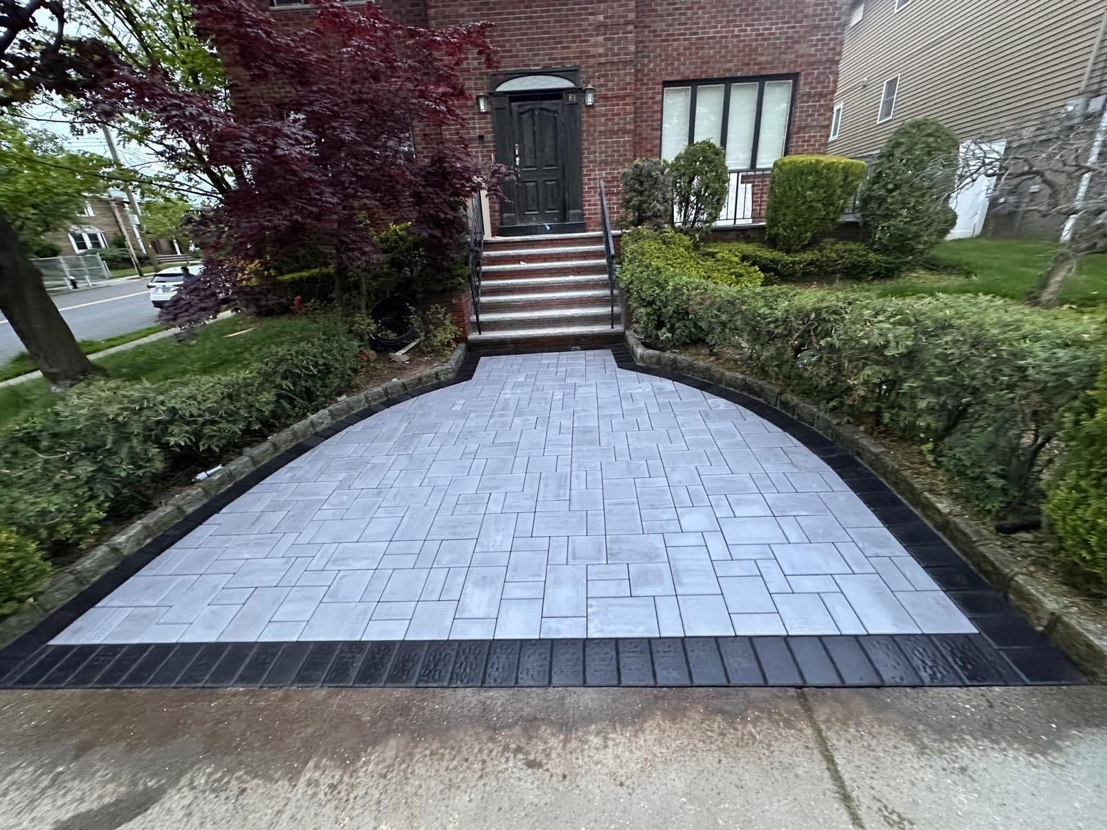 After: new grey paver walk with a dark border