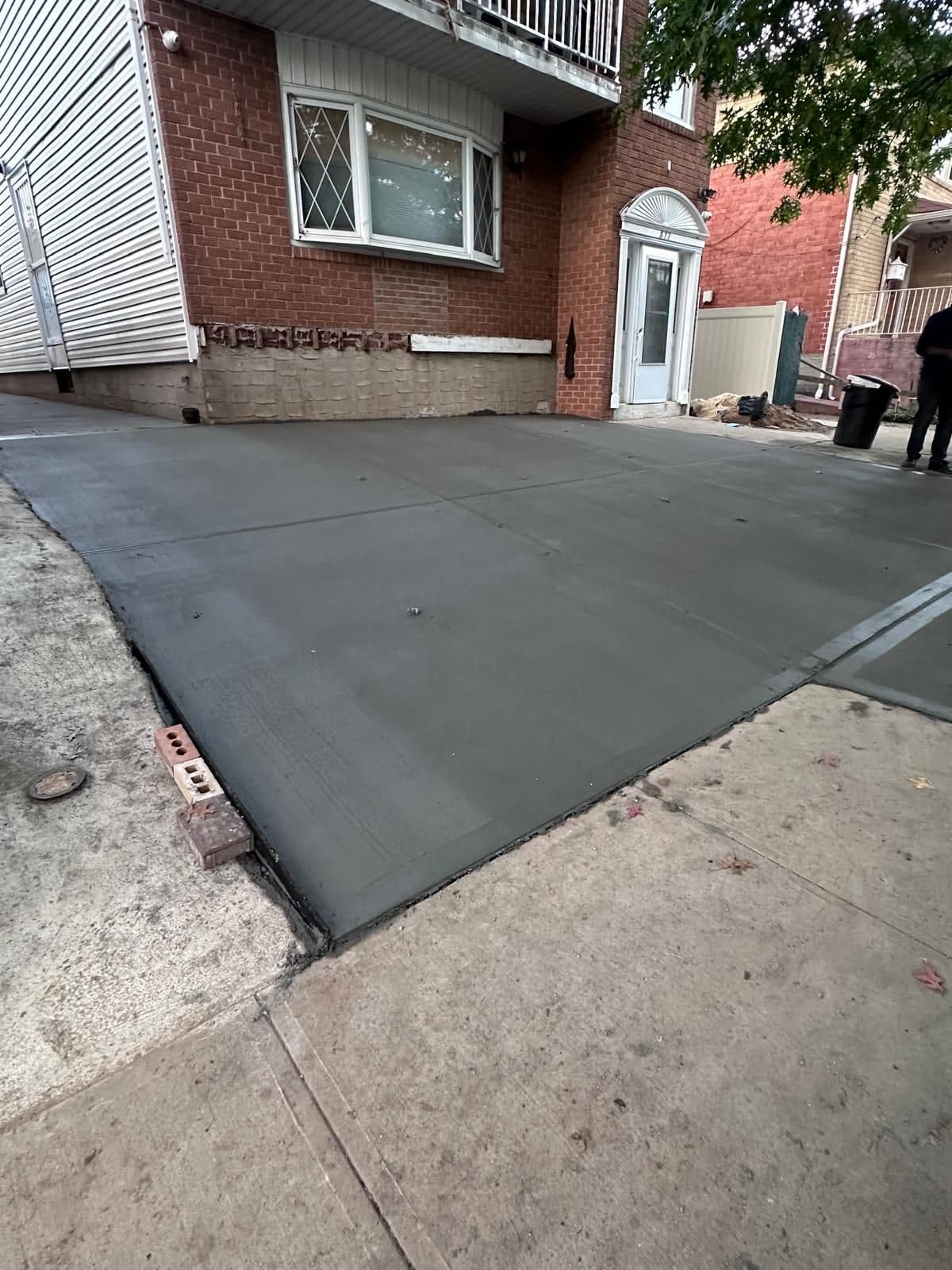 After: new concrete front yard beside the house
